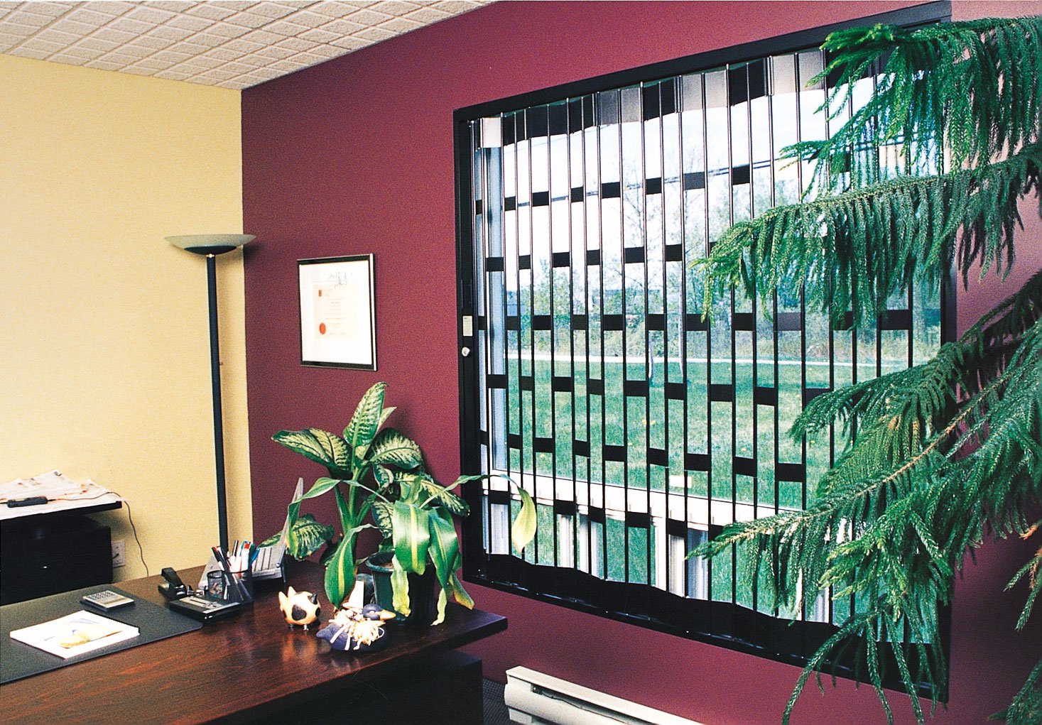 sturdy aluminium sliding folding grille in place at an office