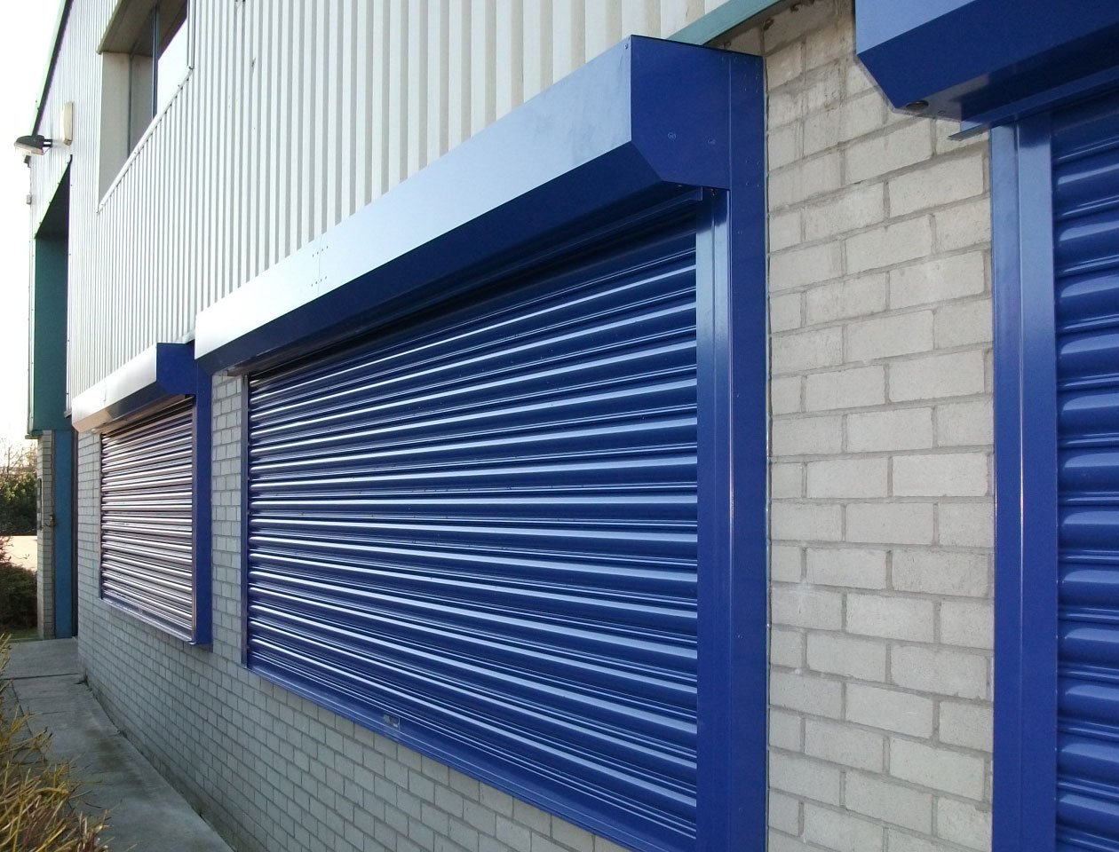 three-blue-roller-shutters